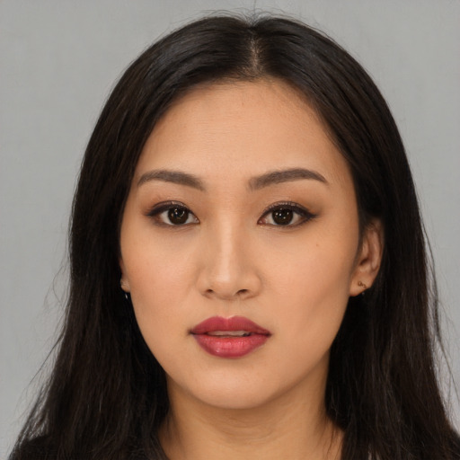 Neutral asian young-adult female with long  brown hair and brown eyes