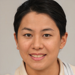 Joyful asian young-adult female with short  brown hair and brown eyes