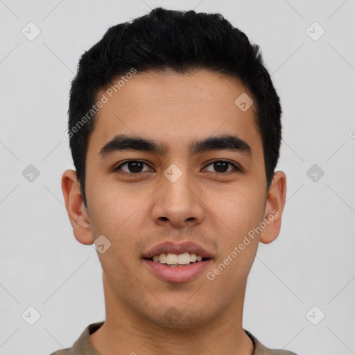 Joyful latino young-adult male with short  black hair and brown eyes