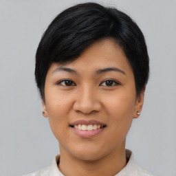 Joyful asian young-adult female with short  black hair and brown eyes