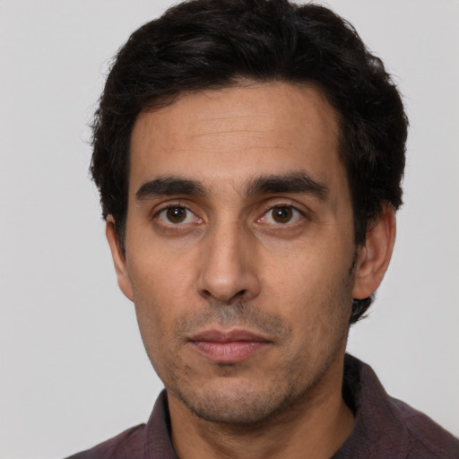 Neutral white young-adult male with short  black hair and brown eyes