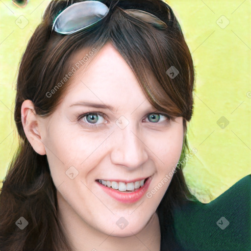 Joyful white young-adult female with long  brown hair and blue eyes