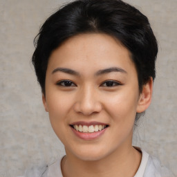 Joyful asian young-adult female with short  black hair and brown eyes