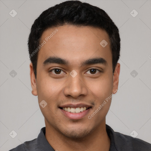 Joyful latino young-adult male with short  black hair and brown eyes