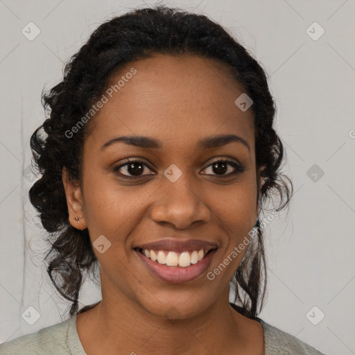 Joyful black young-adult female with medium  black hair and brown eyes