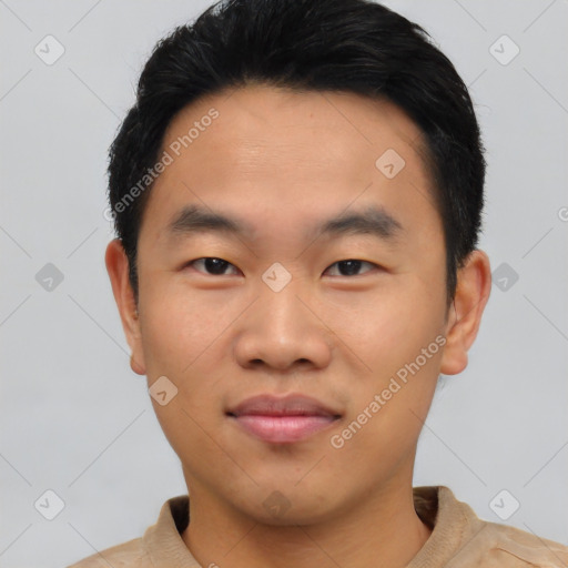 Joyful asian young-adult male with short  black hair and brown eyes