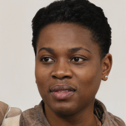 Joyful black young-adult female with short  black hair and brown eyes