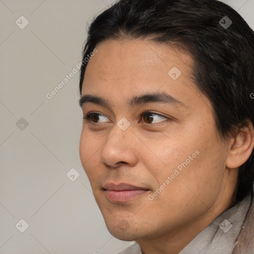 Joyful white young-adult male with short  black hair and brown eyes