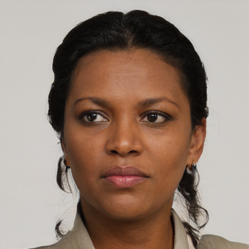 Neutral black young-adult female with medium  black hair and brown eyes
