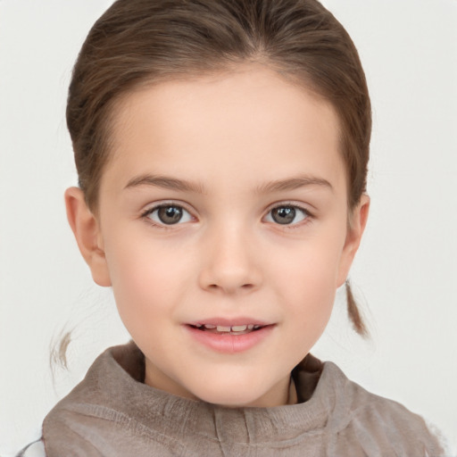 Joyful white child female with short  brown hair and brown eyes