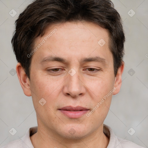 Joyful white adult male with short  brown hair and brown eyes