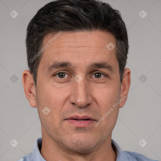 Joyful white adult male with short  brown hair and brown eyes