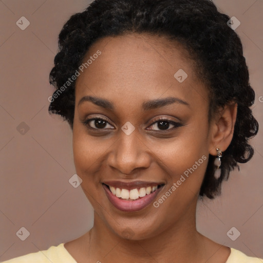 Joyful black young-adult female with long  brown hair and brown eyes