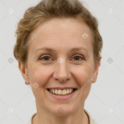 Joyful white adult female with short  brown hair and brown eyes