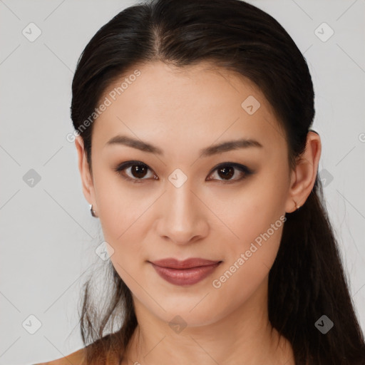 Joyful asian young-adult female with long  brown hair and brown eyes