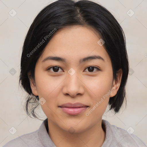 Joyful latino young-adult female with medium  brown hair and brown eyes