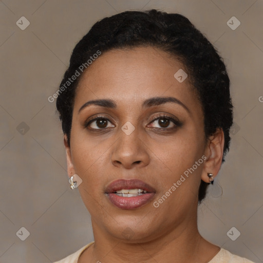 Joyful black young-adult female with short  brown hair and brown eyes