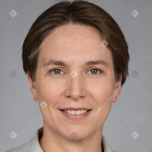 Joyful white adult female with short  brown hair and grey eyes