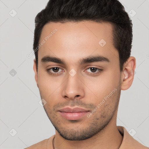 Neutral white young-adult male with short  brown hair and brown eyes