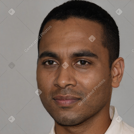 Joyful black young-adult male with short  black hair and brown eyes