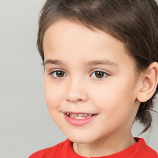 Joyful white child female with medium  brown hair and brown eyes