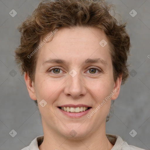 Joyful white adult female with short  brown hair and grey eyes