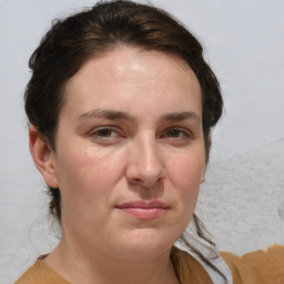 Joyful white adult female with short  brown hair and brown eyes