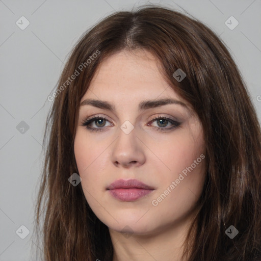 Neutral white young-adult female with long  brown hair and brown eyes