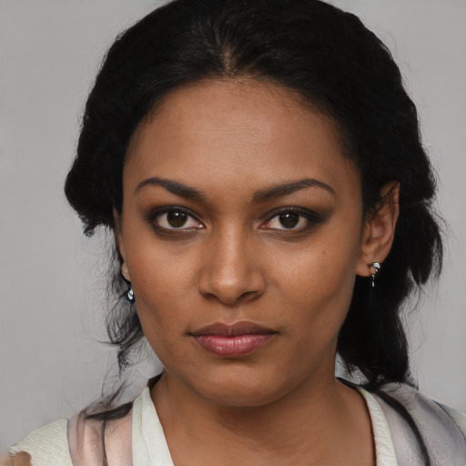 Neutral black young-adult female with medium  black hair and brown eyes