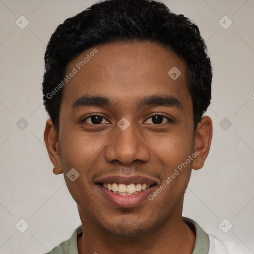 Joyful black young-adult male with short  black hair and brown eyes