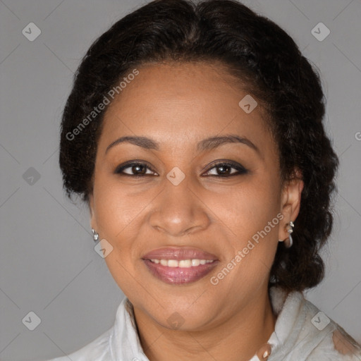 Joyful black adult female with medium  brown hair and brown eyes