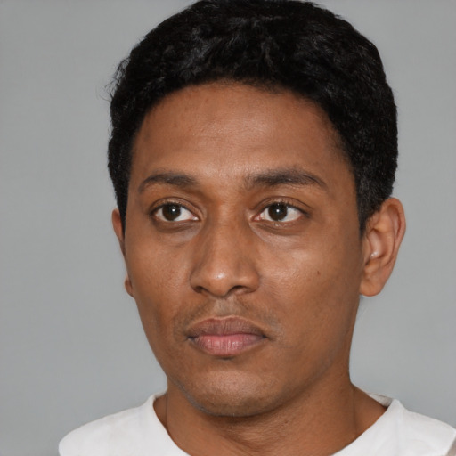 Neutral black young-adult male with short  black hair and brown eyes