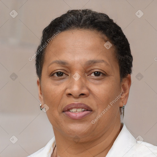 Joyful black adult female with short  brown hair and brown eyes