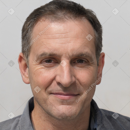 Joyful white adult male with short  brown hair and brown eyes