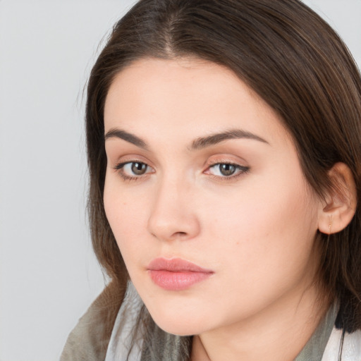 Neutral white young-adult female with medium  brown hair and brown eyes