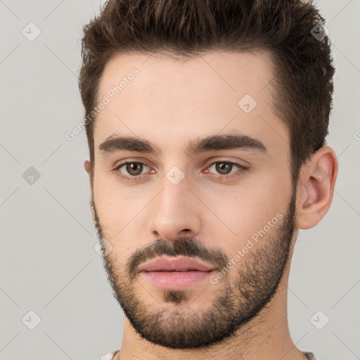 Neutral white young-adult male with short  brown hair and brown eyes