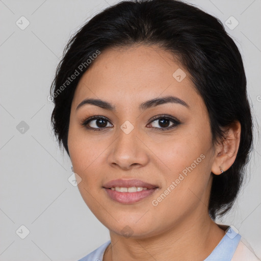 Joyful latino young-adult female with medium  brown hair and brown eyes