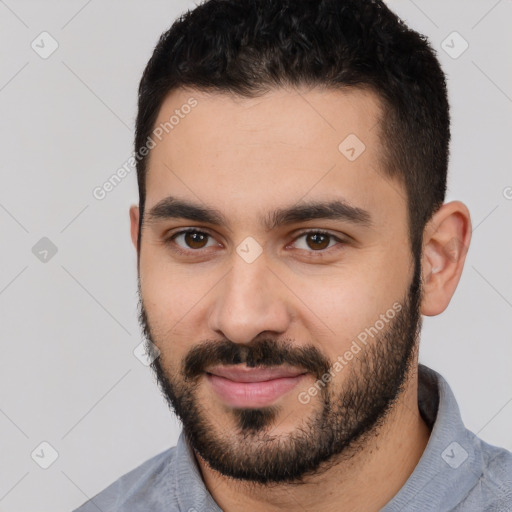 Joyful white young-adult male with short  black hair and brown eyes