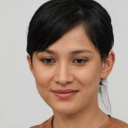 Joyful asian young-adult female with short  brown hair and brown eyes