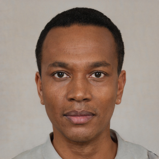Neutral black young-adult male with short  black hair and brown eyes