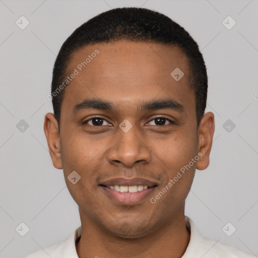 Joyful black young-adult male with short  black hair and brown eyes