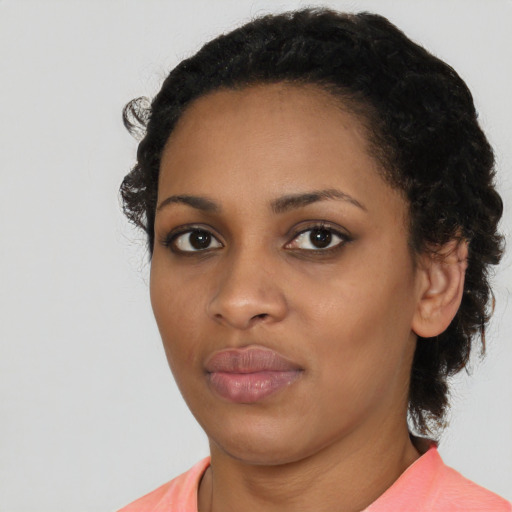 Neutral black young-adult female with medium  black hair and brown eyes