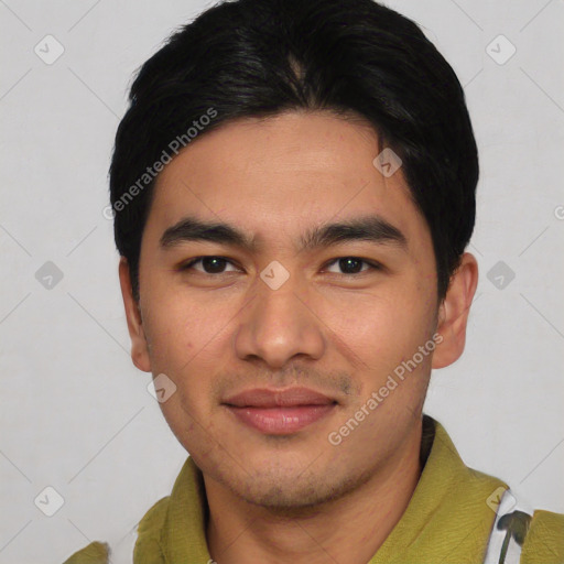 Joyful asian young-adult male with short  black hair and brown eyes