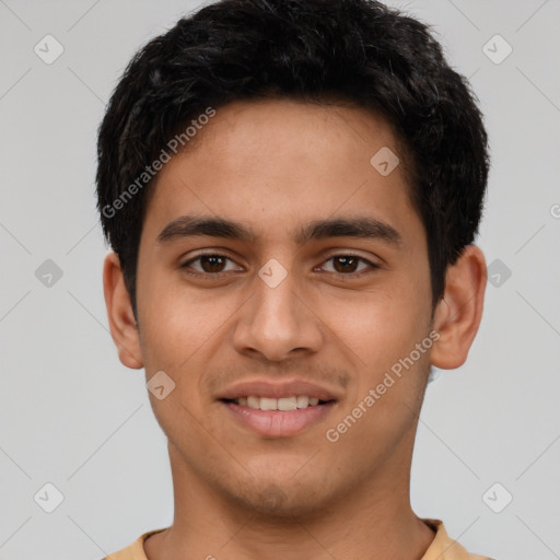 Joyful latino young-adult male with short  brown hair and brown eyes