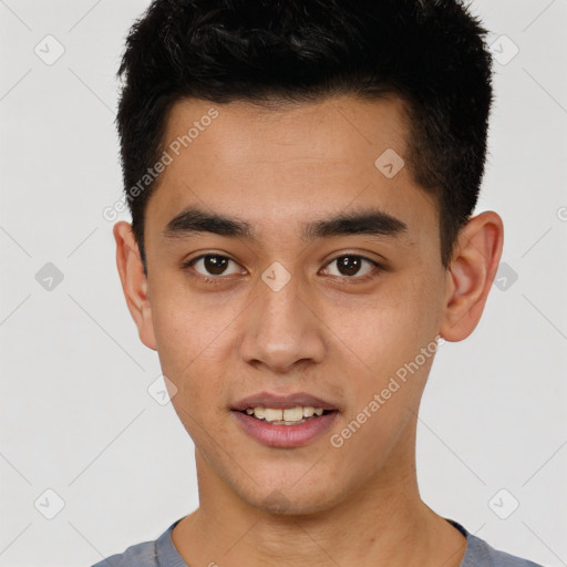 Joyful latino young-adult male with short  black hair and brown eyes