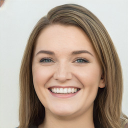 Joyful white young-adult female with long  brown hair and green eyes