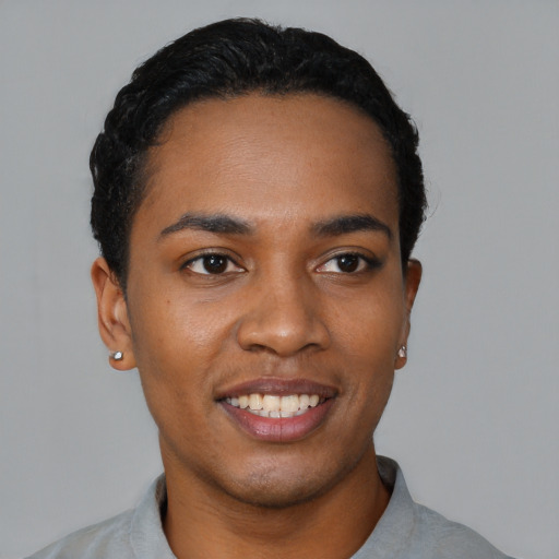 Joyful black young-adult male with short  black hair and brown eyes