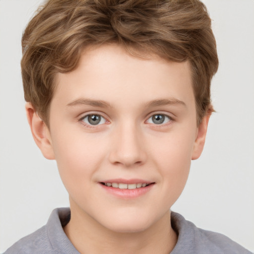 Joyful white child male with short  brown hair and grey eyes