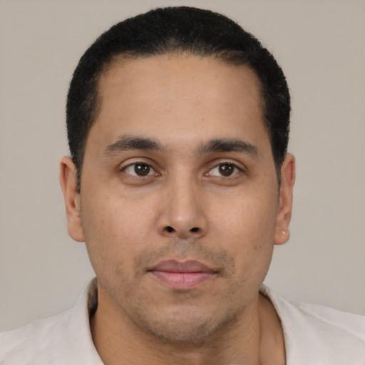 Neutral latino young-adult male with short  black hair and brown eyes