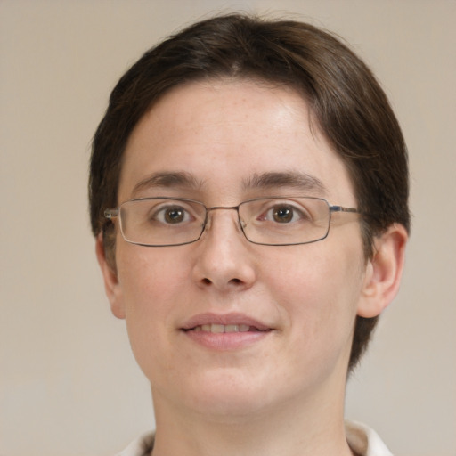 Joyful white young-adult female with short  brown hair and green eyes